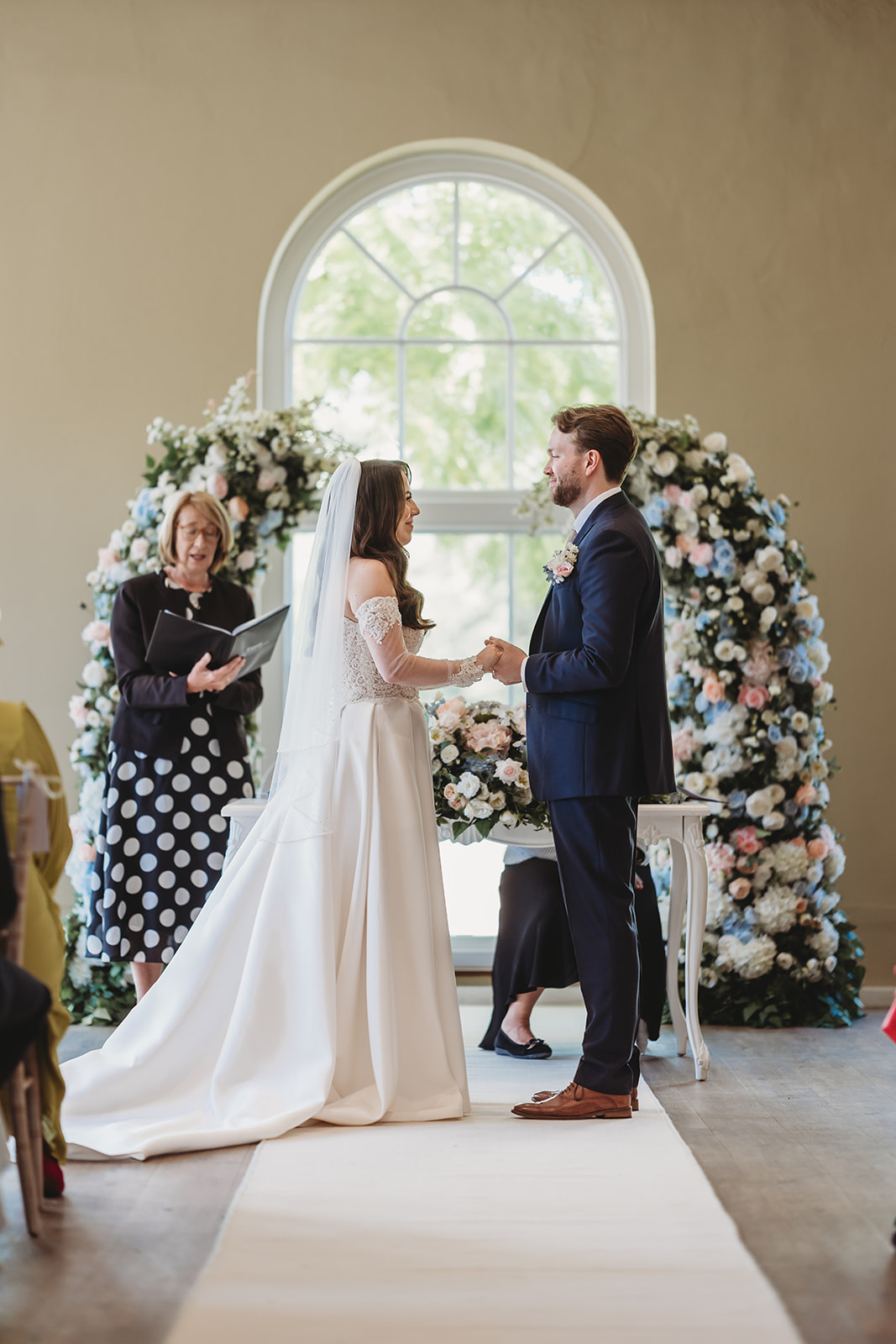 Wedding ceremony in the orangery at Braxted Park, Essex