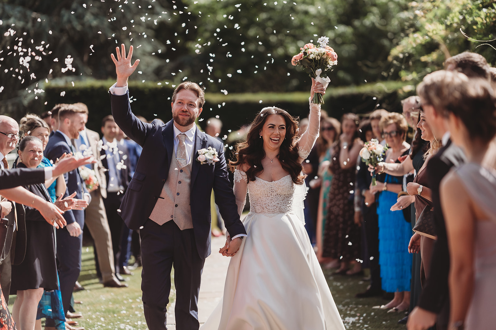 Confetti in the walled garden at a Braxted Park wedding