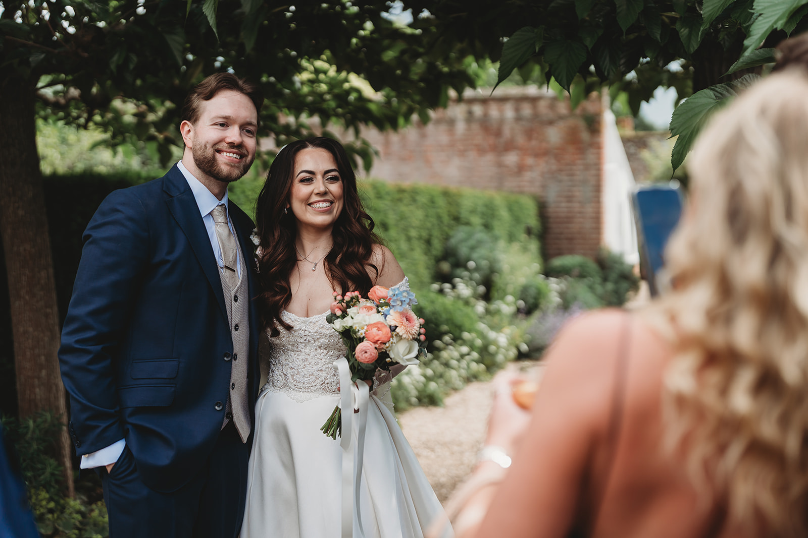 Drinks reception in the walled garden at a Braxted Park wedding